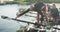 Four senior caucasian men and women preparing rowing boat in a river