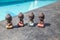 four small buddha statues in calm different rest pose.