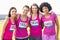 Four smiling runners supporting breast cancer marathon