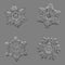 Four snowflakes isolated on uniform gray background