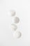Four soaring white zephyr marshmallow on white background. flying food levitation
