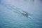 Four sportsmen canoeing, blue river