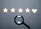 Four stars and a heart instead of the fifth and a magnifying glass. The concept of customer choice. Search. General recognition