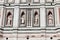 Four statues in niches on Bell Tower on Piazza del Duomo in Florence in Italy