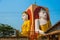 Four statues of sitting Buddhas. Pagoda Kyaikpun Buddha. Bago, Myanmar. Burma.