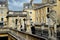 Four statues standing guard at the Roman Baths in Bath.