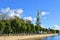 Four story bell tower with tall gilded spire 1755â€“1758 of St. Nicholas Cathedral and garden. Saint Petersburg