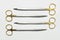 Four surgical scissors with golden plated handles