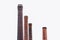 Four tall pipes of red brick, factory chimney.
