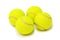 Four tennis balls isolated