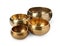 Four Tibetan singing bowls on white background