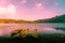 Four traditional balinese fishing boats on the shore of Lake Tamblingan at sunset in Balim Indonesia, Asia