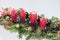 Four traditional red advent candles with christmas decoration