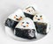 Four triangle onigiri on a white plate