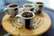 Four types of coffee beans in cups in an organic store.