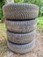 Four used car winter tires with wheels stacked