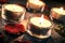 Four Valentine Candlelights On Slate With Rose Petals And Leafs