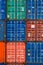 Four vertical rows of shipping containers