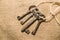 Four very old keys tied with a rope on old cloth