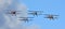 Four Vintage  SNCAN Stampe - Vertongen SV-4 Biplanes in flying formation.