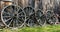 Four Wagon Wheels lay against an old barn at Williams Barn