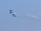 Four war jet planes in sky
