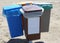 four waste bins for the separate collection of garbage on the be