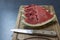 Four watermelon slices with knife