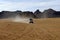 Four-wheel drive jeep on a desert road