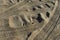 Four wheel drive tracks in soft sand textured background