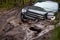 Four wheel drive vehicle bogged down in soft mud