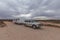 Four wheel drive vehicle and large caravan parked on an outback track.