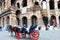 Four-Wheeled-Carriage in front of Roman Colosseum