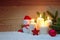 Four white Advent candles burning and Snowman .