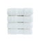 Four white bath towels in stack isolated over white