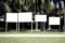 four white billboards blank in the open park for advertisement like photo frame and the background blur
