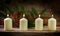 Four white burning candles on the fourth advent, decorated with