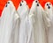 Four White ghosts on orange background