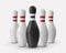 Four white and one black bowling pins isolated on white background.