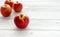 Four Whole Red Apples on Grey Wooden Background