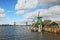 Four windmills on the banks of the channel