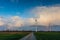 four windmills left and right from a dirt road