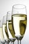 Four wine glasses with white wine