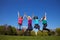 Four women jumping in the air