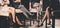 Four women sitting with elegant long legs in stockings