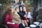 Four women take a selfie in a cafe