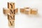 Four wooden cubes arranged in stack with letters YMMV meaning Your mileage may vary on them, space for text / image at down