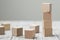 Four wooden toy cubes on grey wooden background