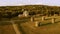 Four wooden windmills and church and another buildings in the village.