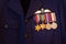 Four World War II service medals on a Royal Australian Air Force uniform jacket, the medals are thee 1939-45 Star, Pacific Star, W